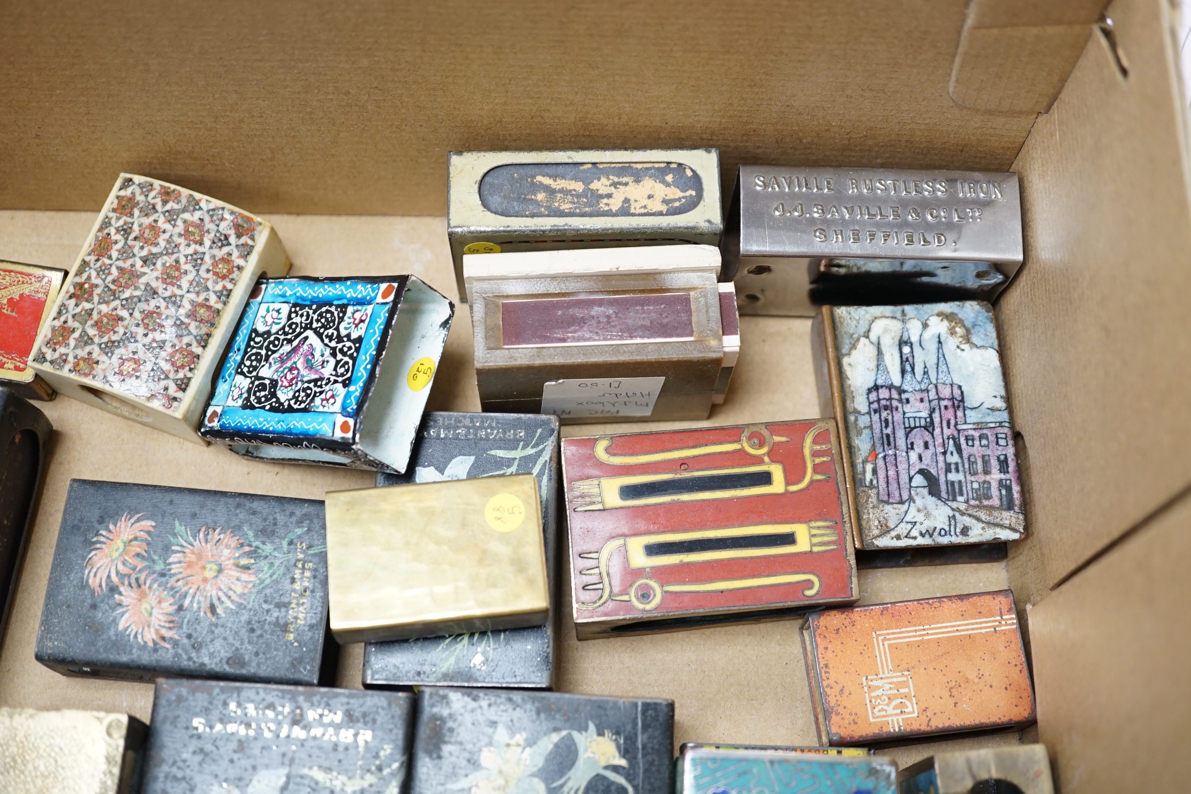 A collection of advertising and other enamelled metal match box holders